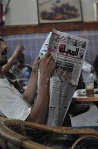 Reading newspapers in a cafe on Jemaa el-Fnaa
